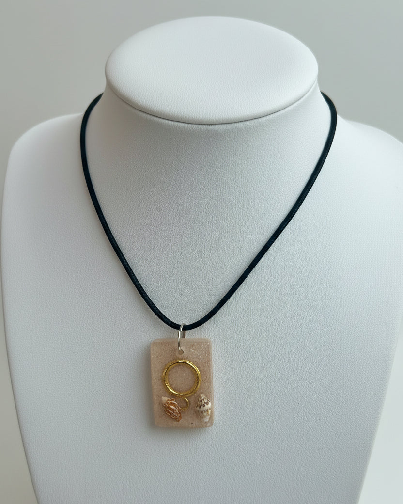 Necklace with a shell pendant on a white background